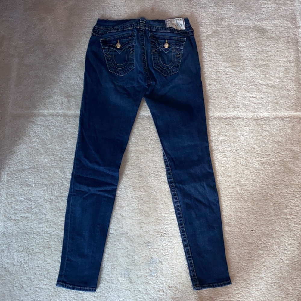 True Religion skinny stretch jeans with gold border stitching.